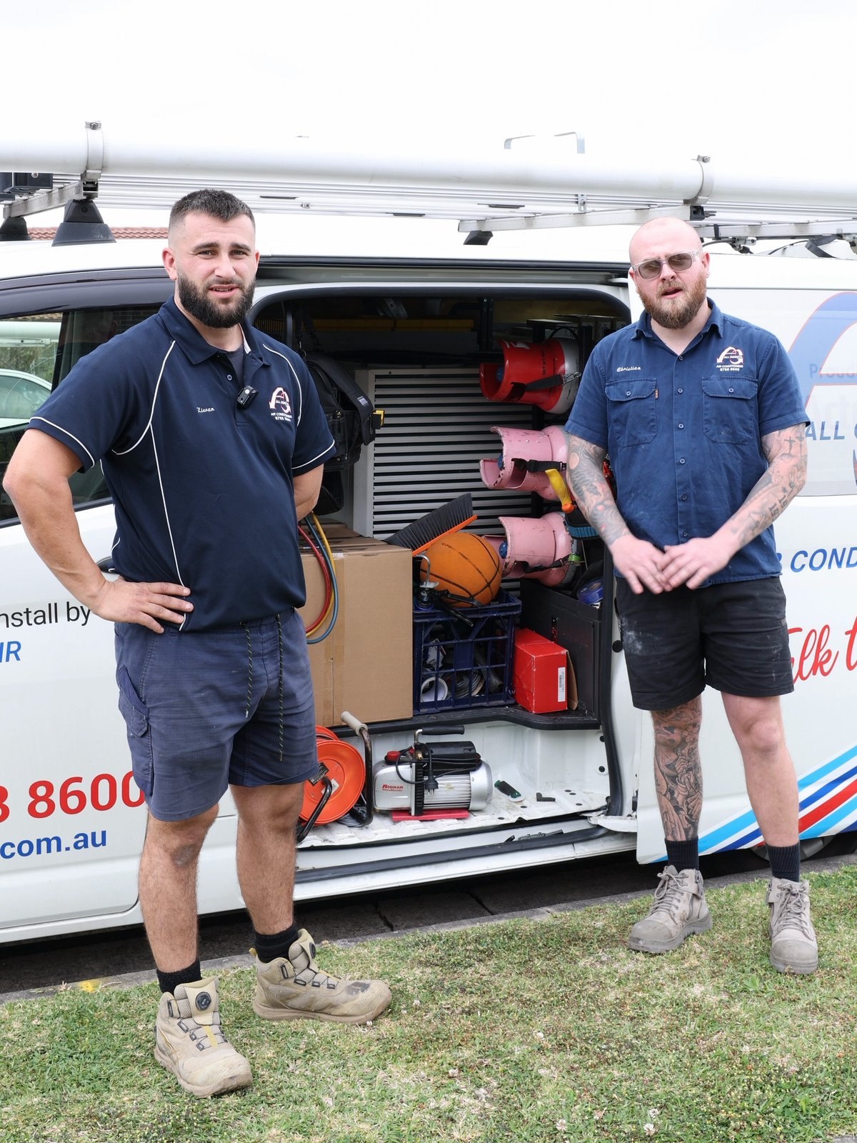 Two All General service technicians at their stocked service van